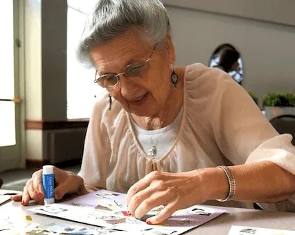Senior resident engaging in an arts and crafts activity