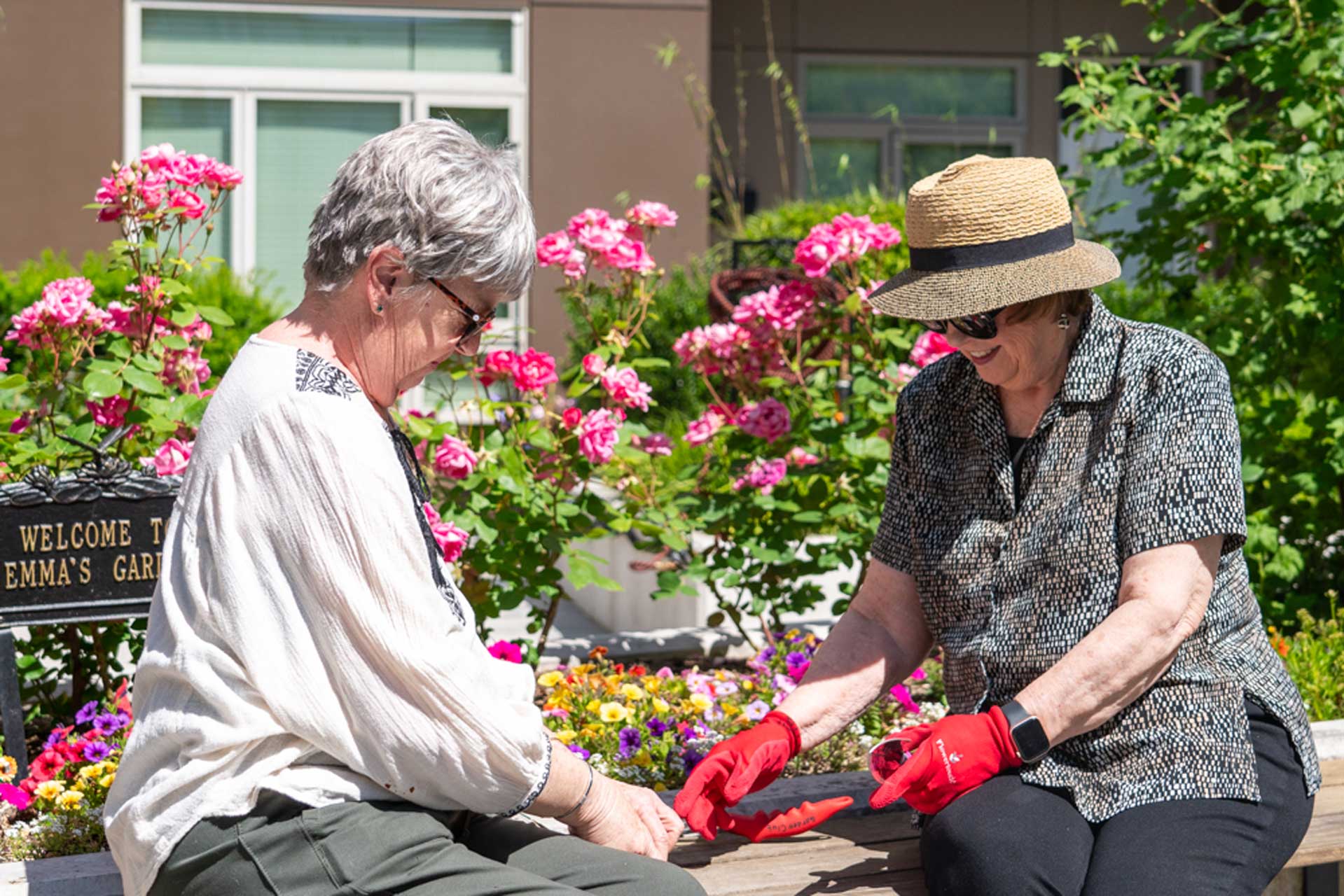 Residents gardening together in a lush garden