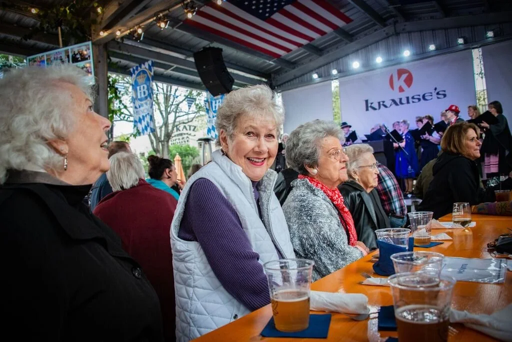 Residents enjoying an event outdoors at a community gathering