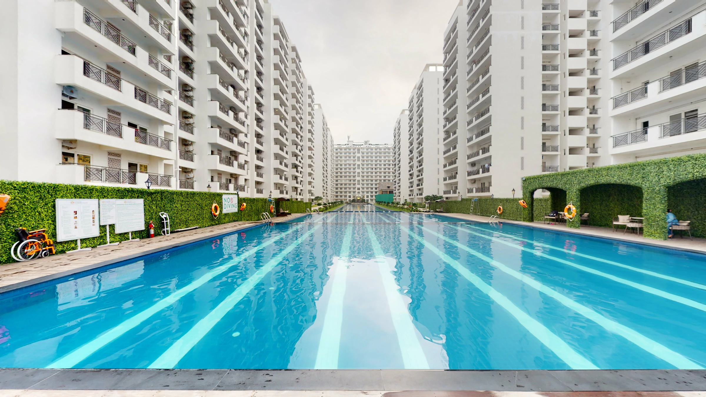 Outdoor swimming pool surrounded by residential buildings