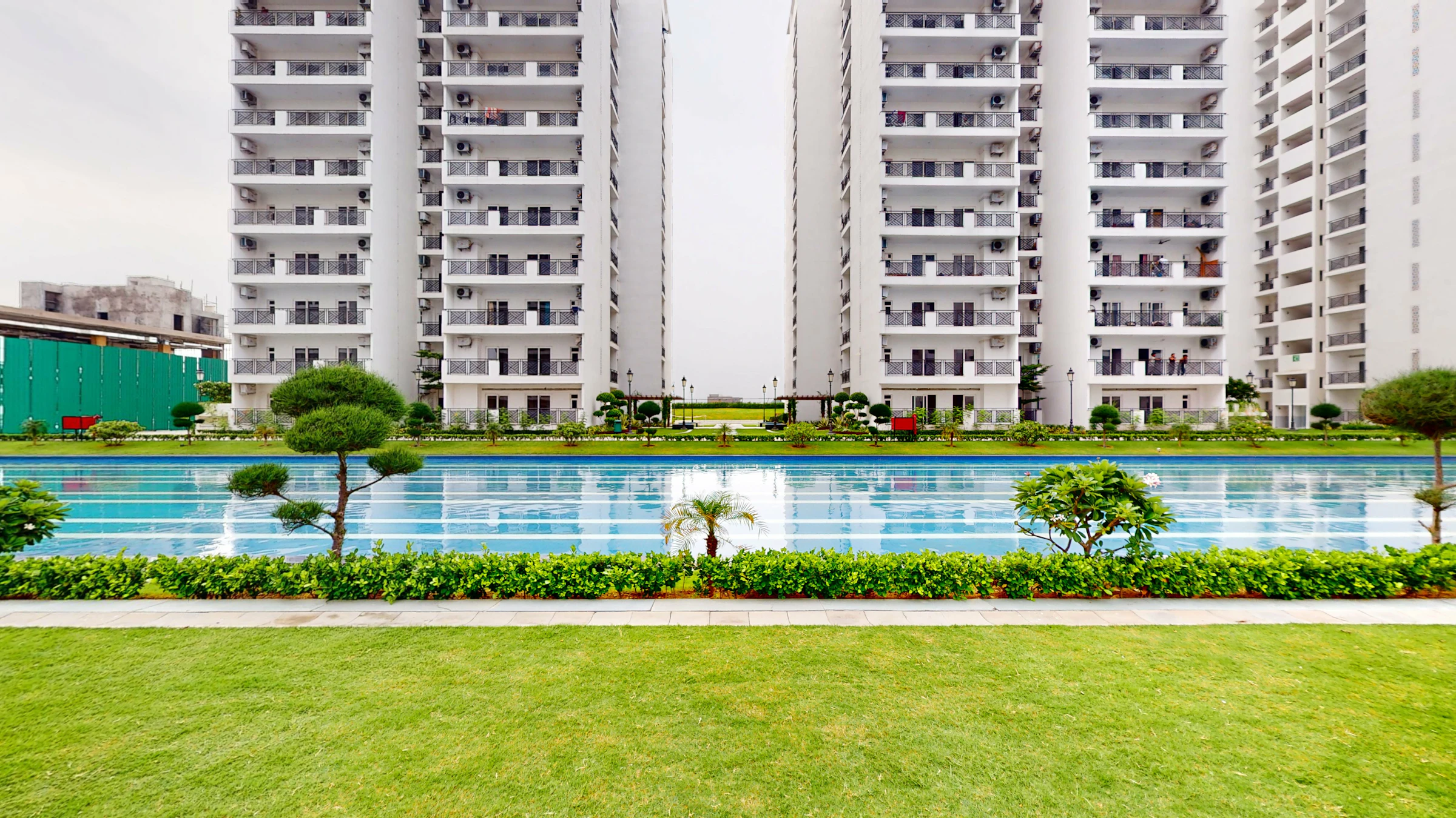 Outdoor view of a swimming pool surrounded by buildings