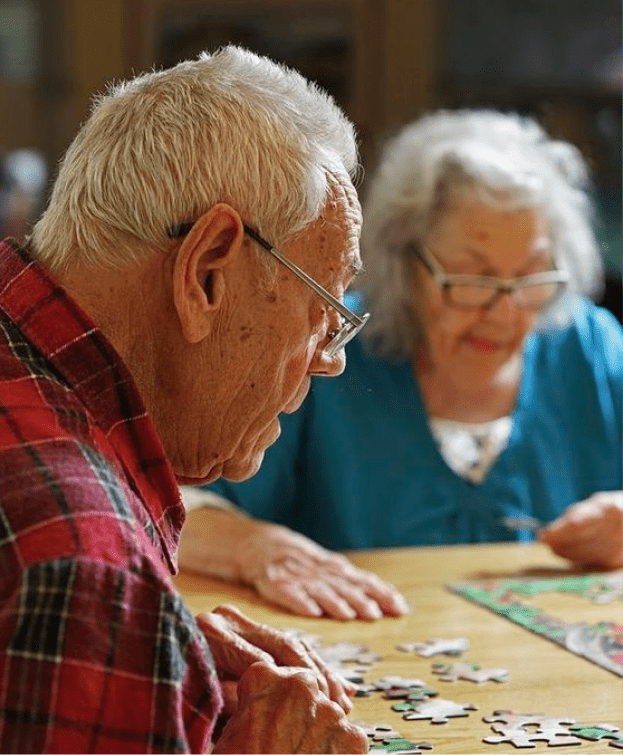 Residents working on a puzzle together