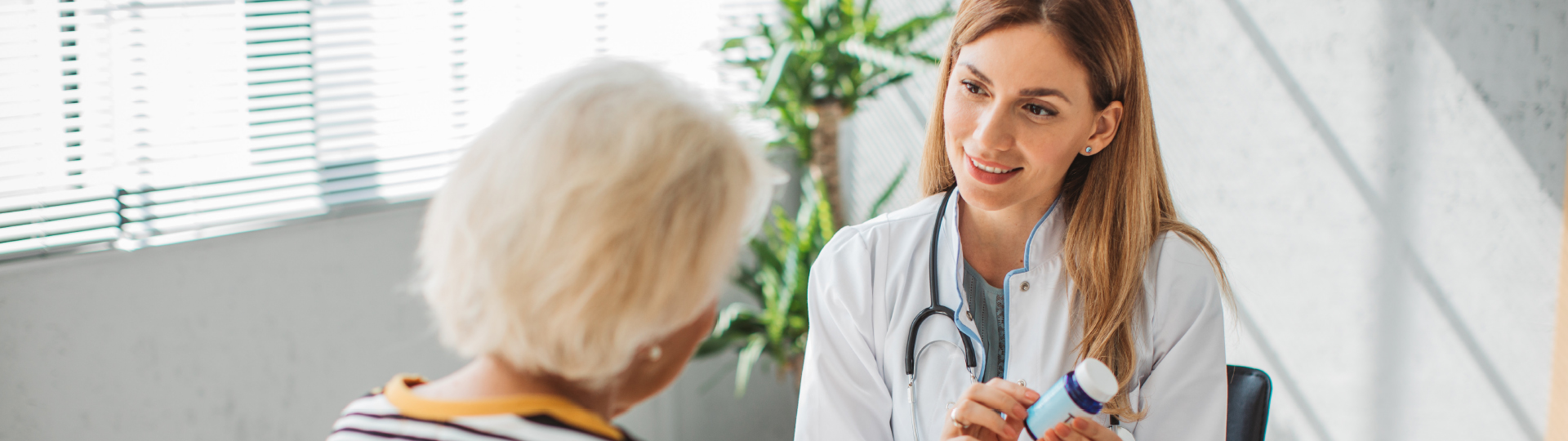 A healthcare professional discussing medication with a resident