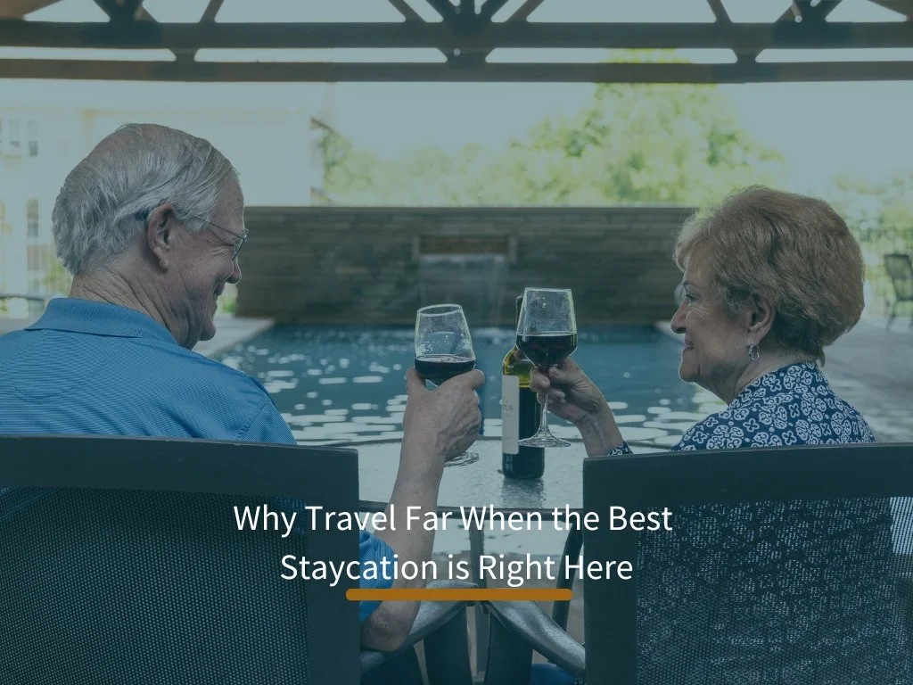 Two residents enjoying drinks by the pool area