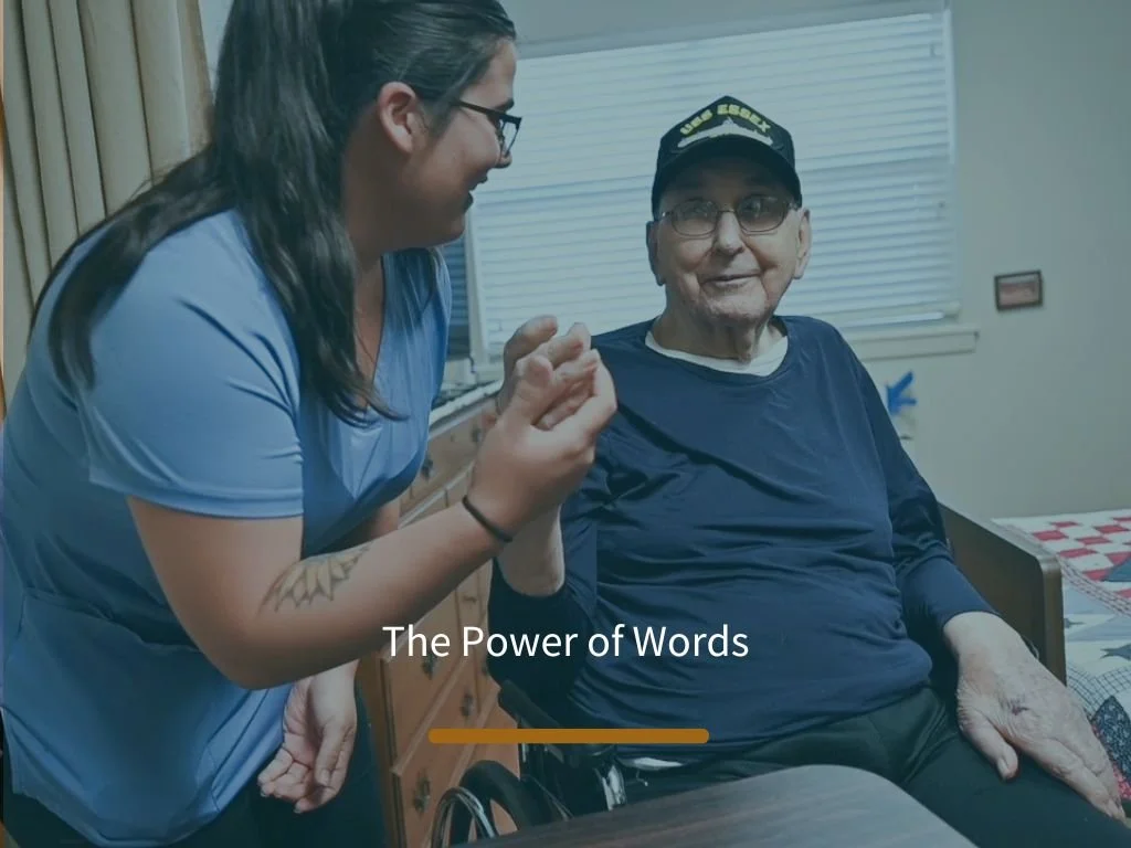 Staff member interacting with a resident in a room