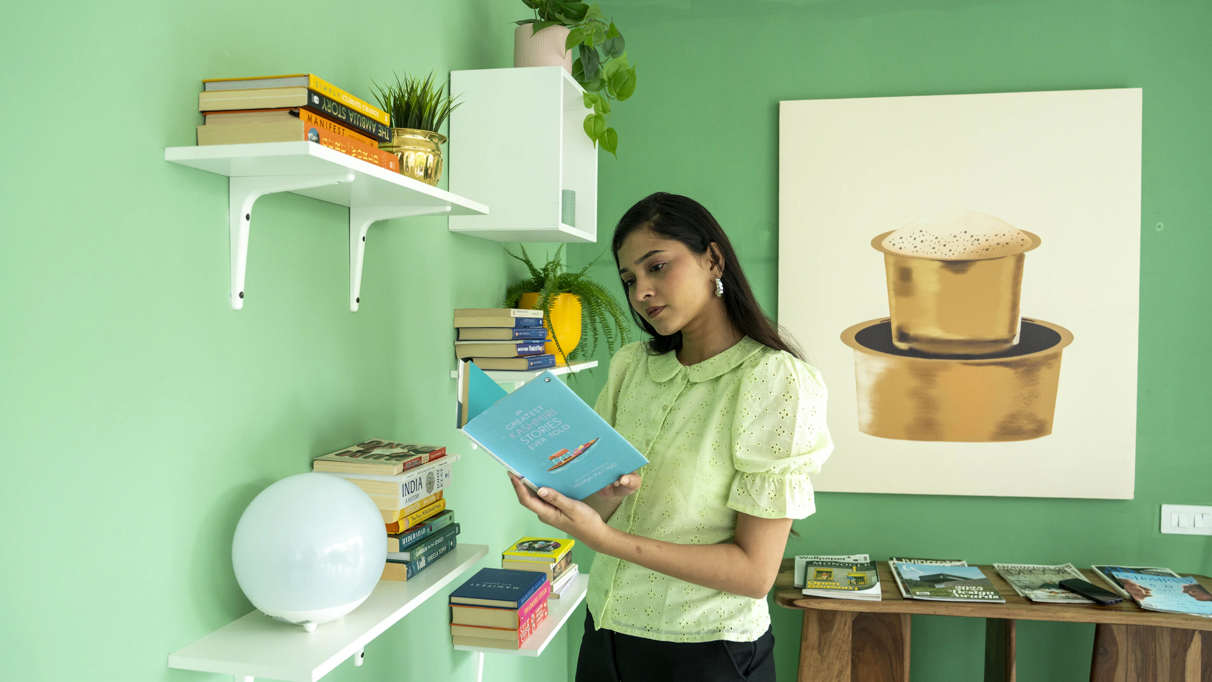 Young woman reading a book in a cozy interior