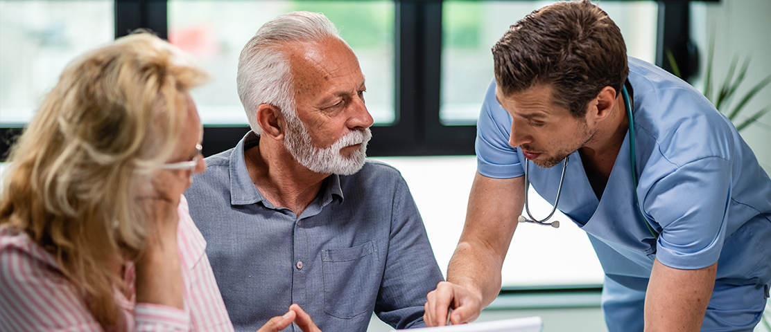Healthcare professional interacting with senior resident