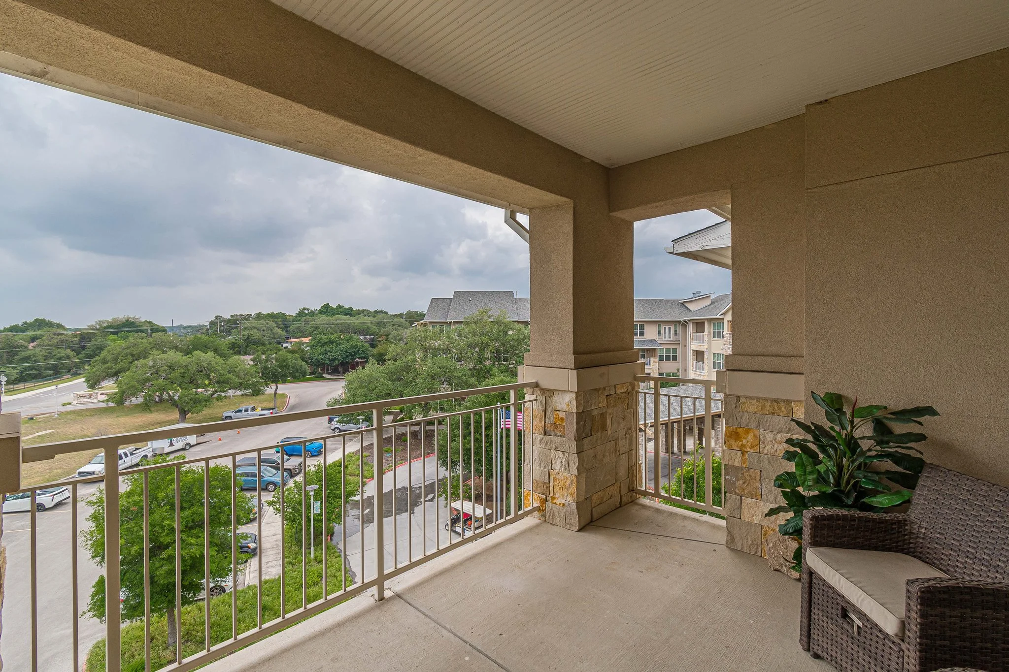 Outdoor balcony view of the facility with greenery