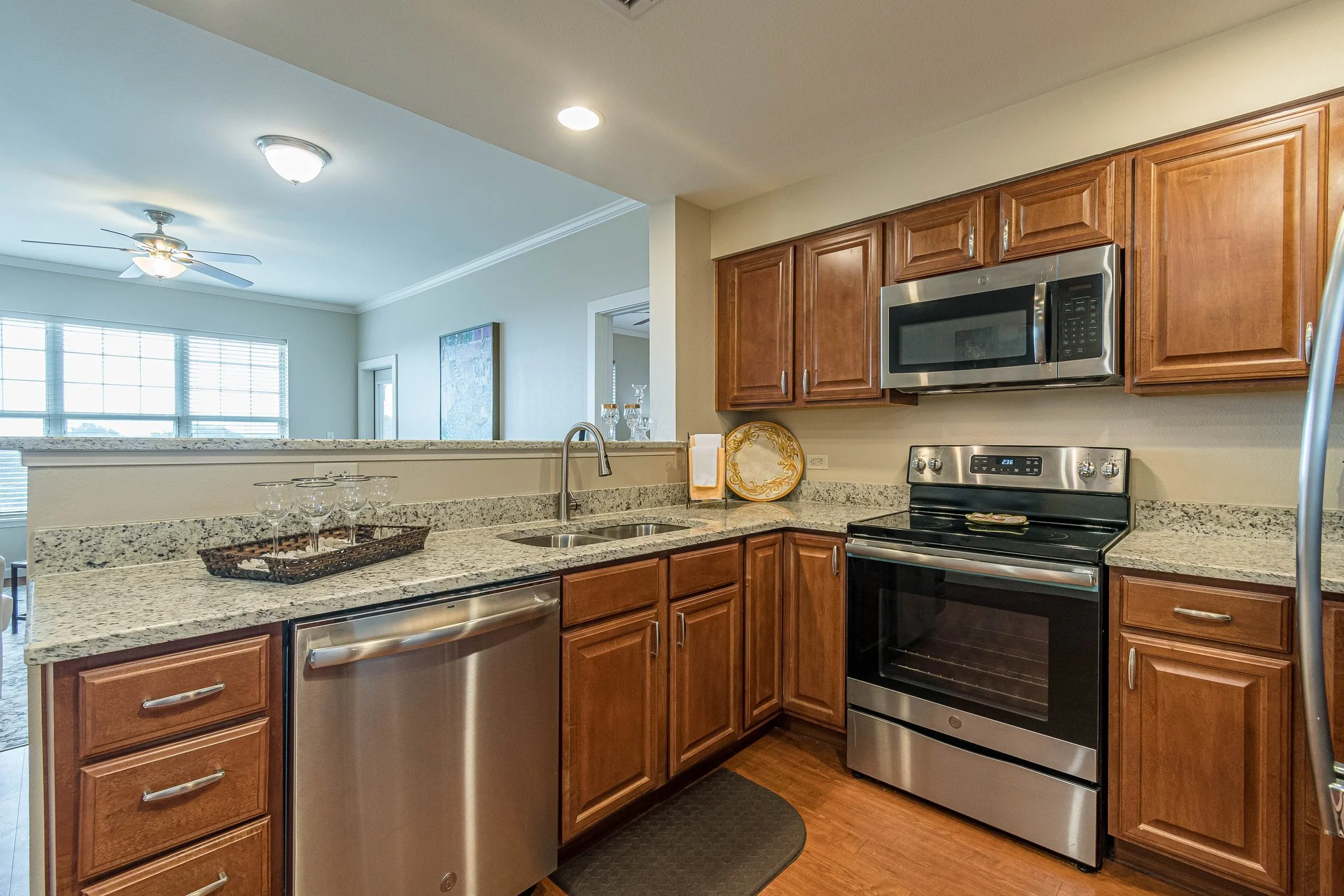 Modern kitchen with stainless steel appliances and wooden cabinets
