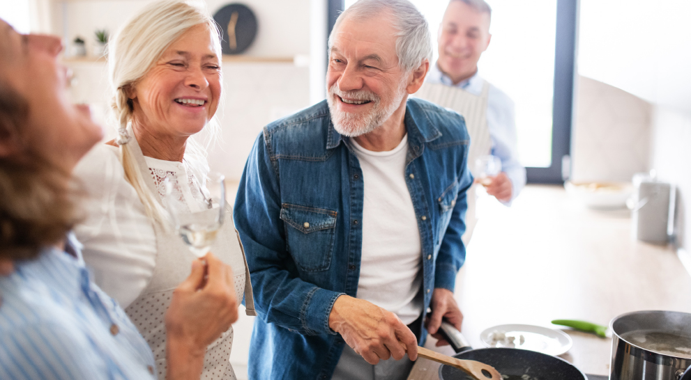 Residents cooking together in a shared kitchen