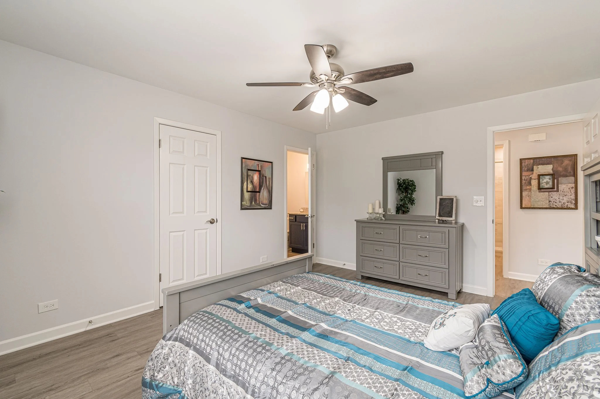 Private bedroom with a bed and dresser
