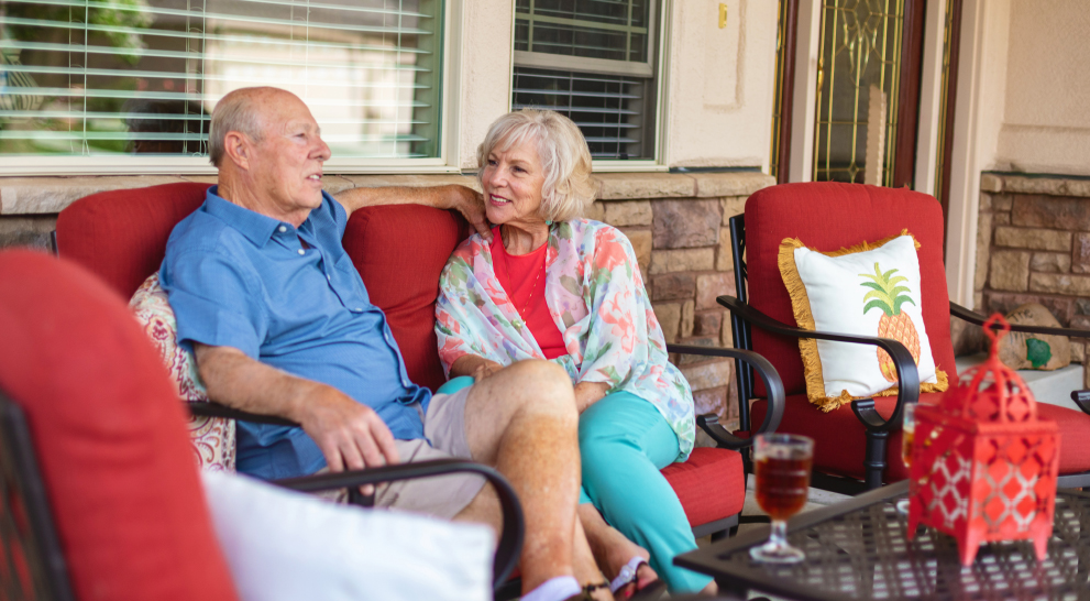 Couple enjoying conversation on a porch