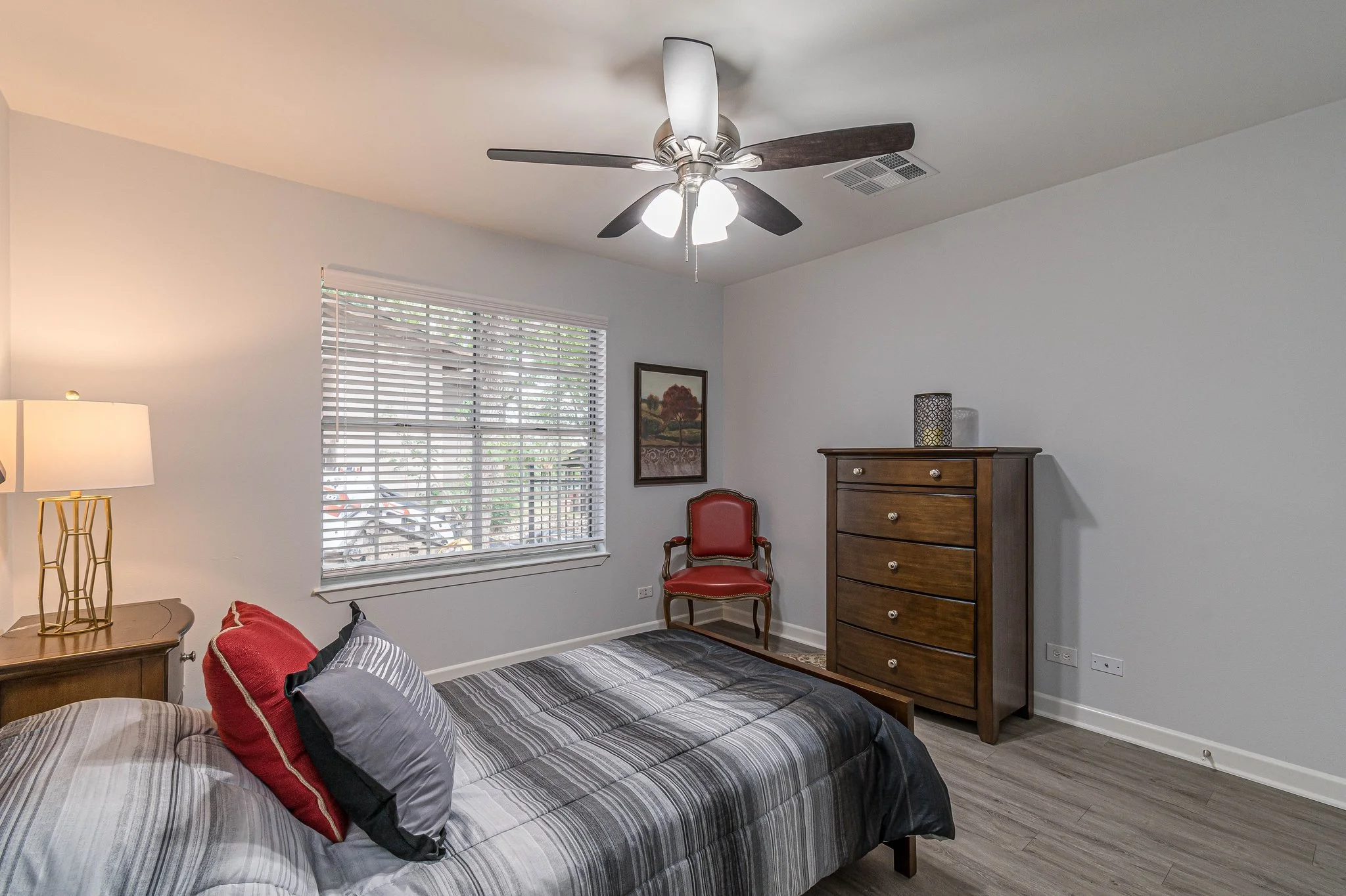 Cozy private room with a bed and furniture