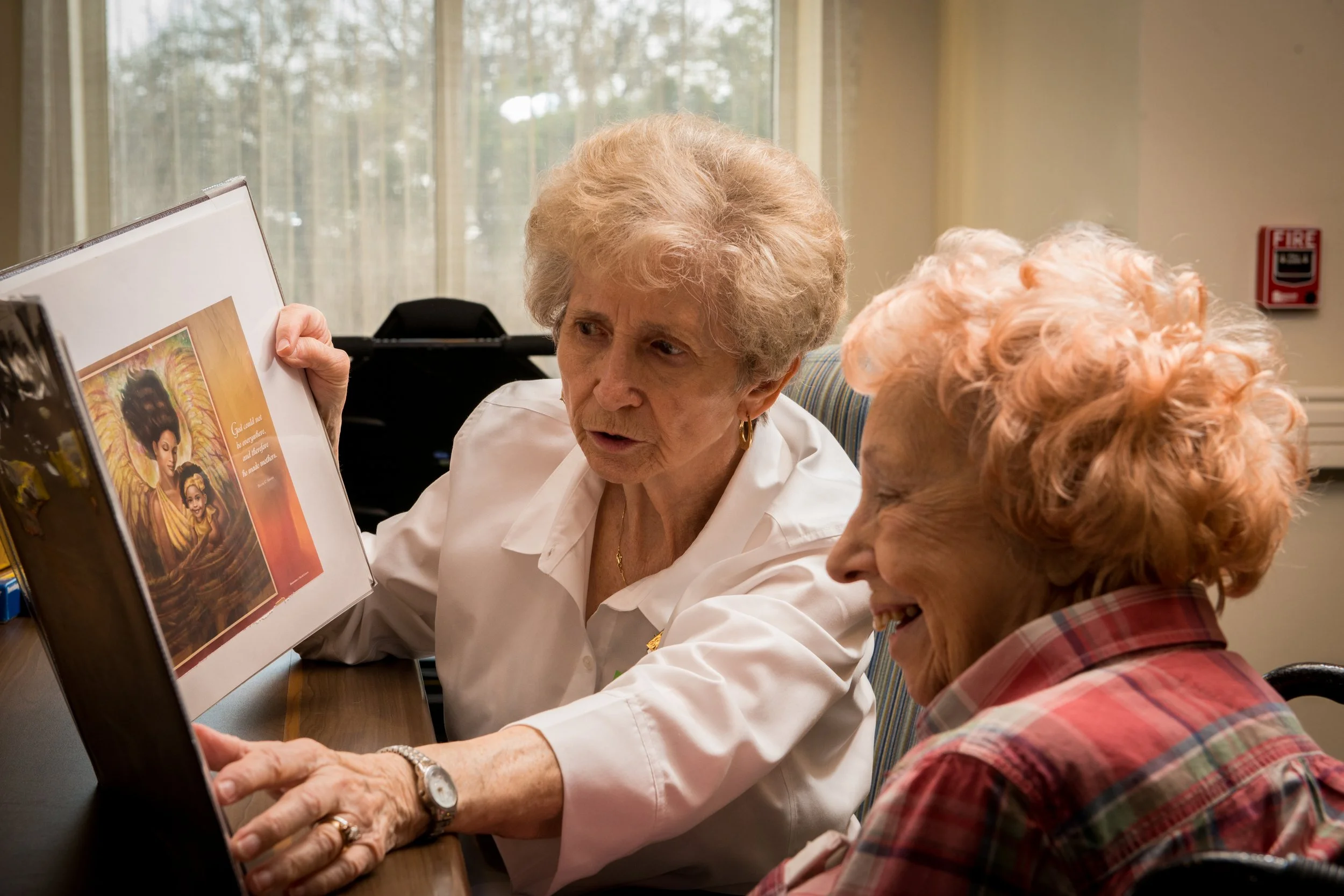 Residents engaging in a meaningful conversation over a photo
