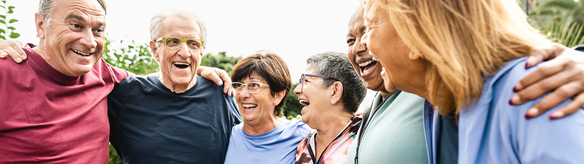 Residents laughing together in an outdoor space