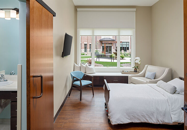 Well-furnished resident room with a view of the courtyard