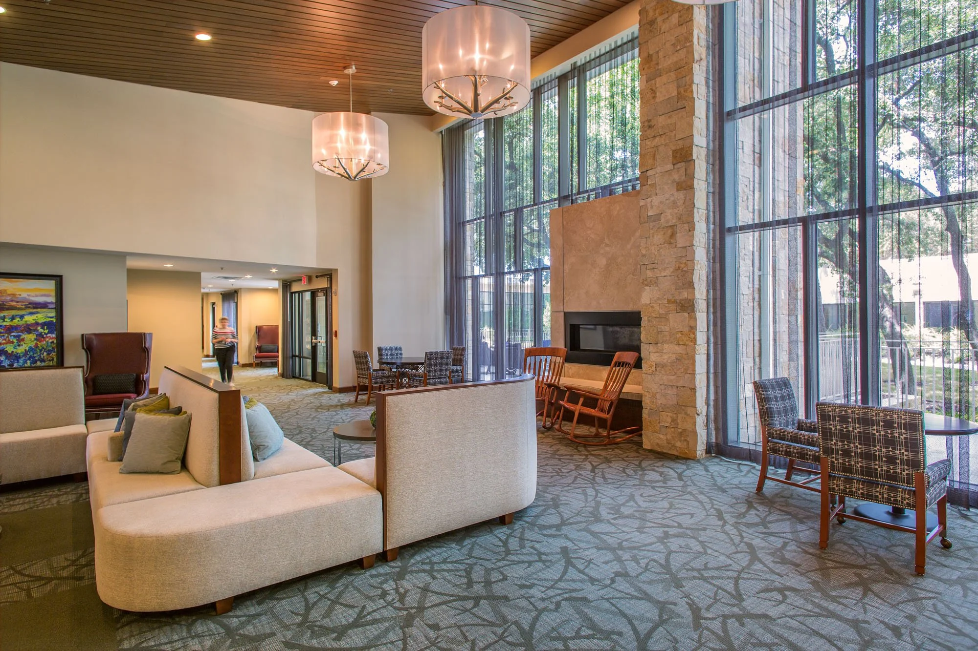 Bright common area with seating and large windows