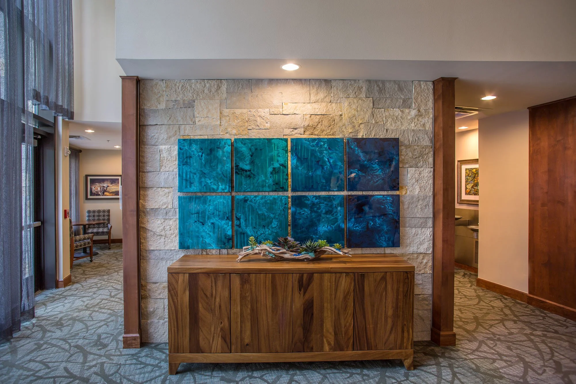 Interior lobby area with decorative art and furniture