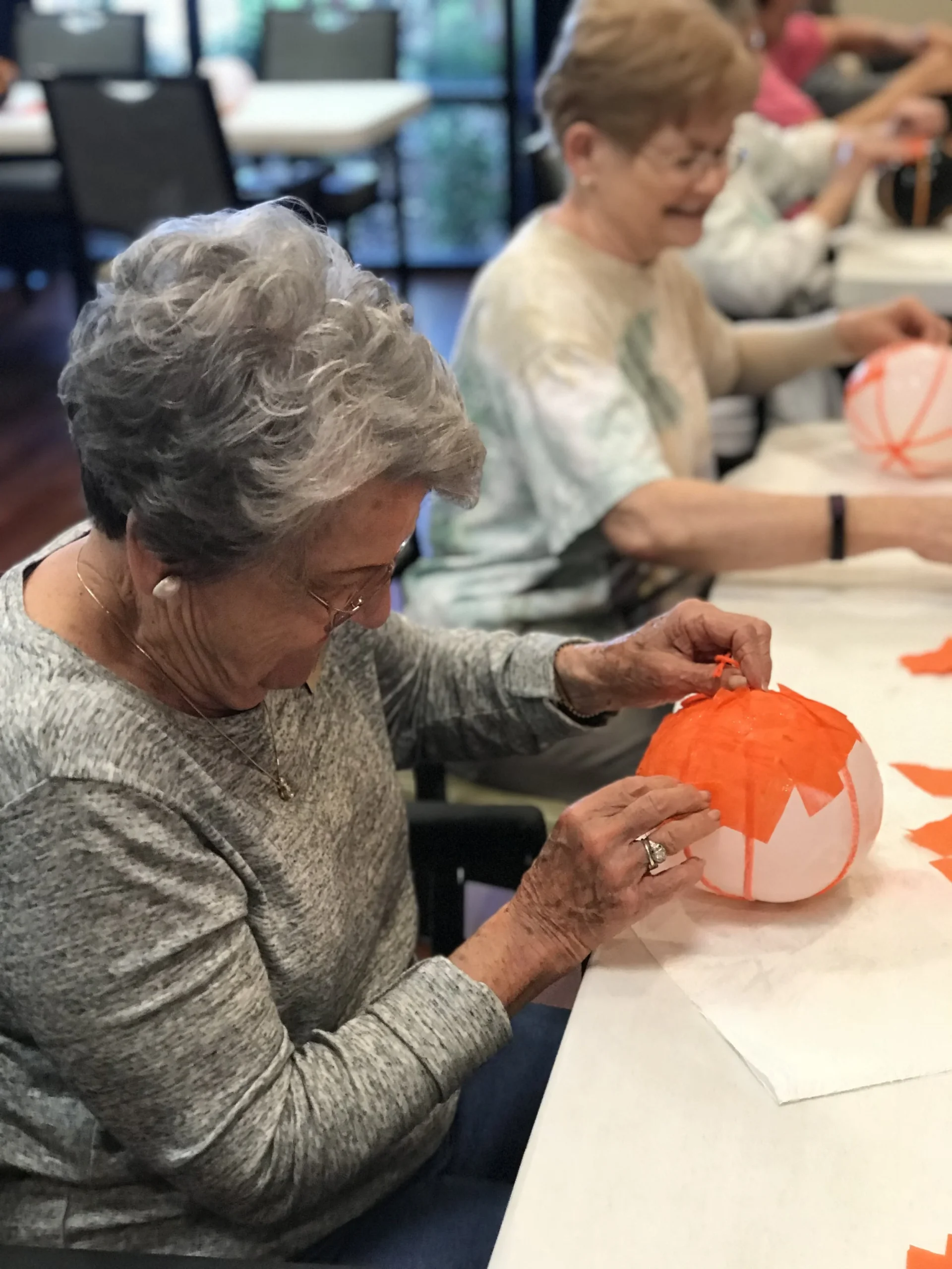 Residents participating in a crafting activity