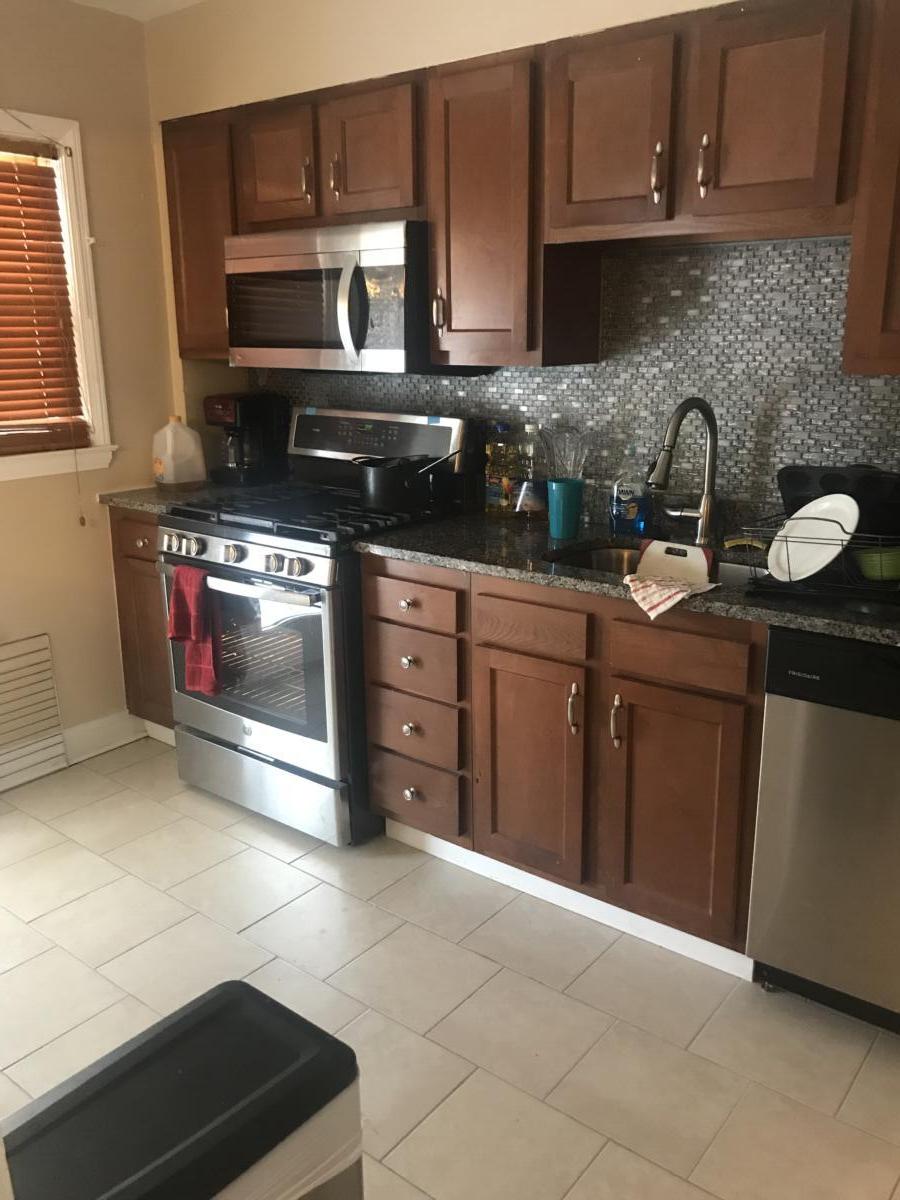 Kitchen area with appliances and cabinets