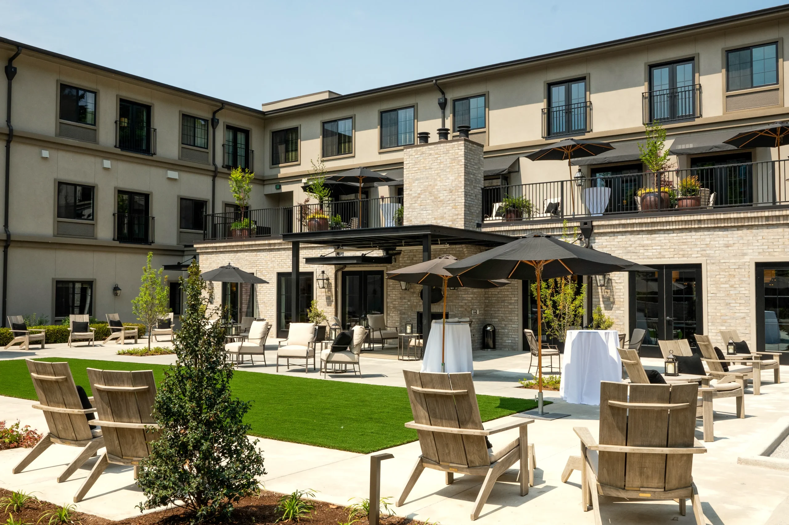 Outdoor patio area with seating and garden