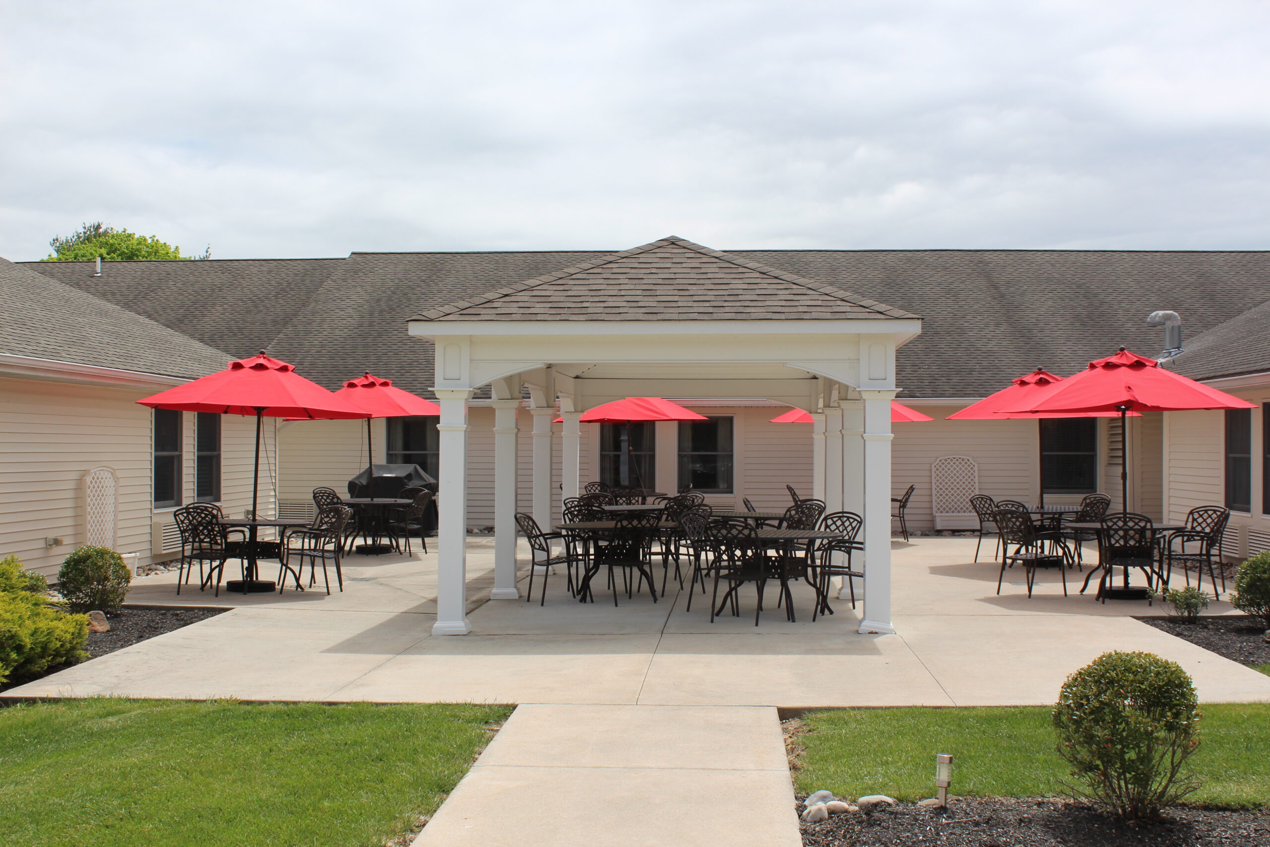 Outdoor seating area with red umbrellas