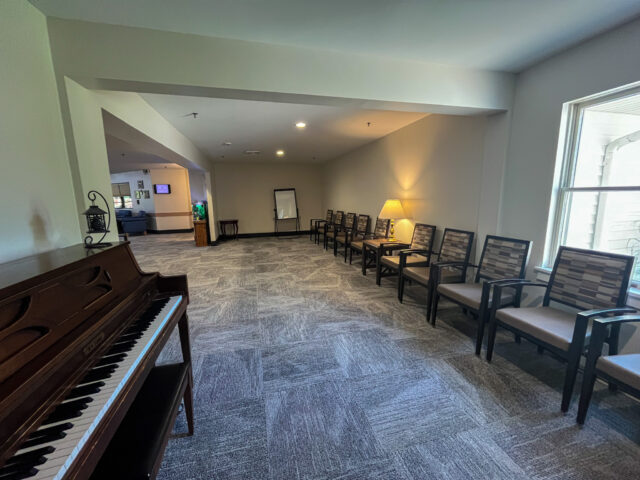 Interior common area with seating and piano