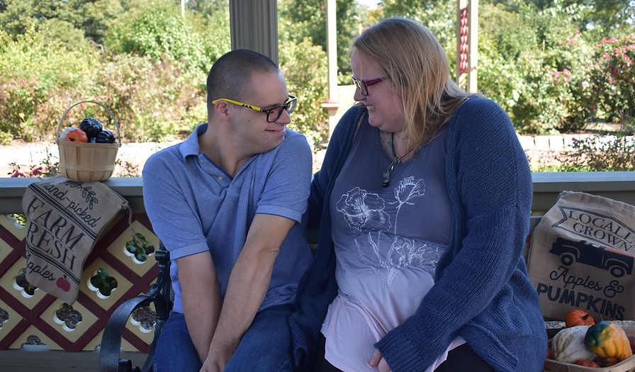 Residents sharing a joyful moment in an outdoor space.