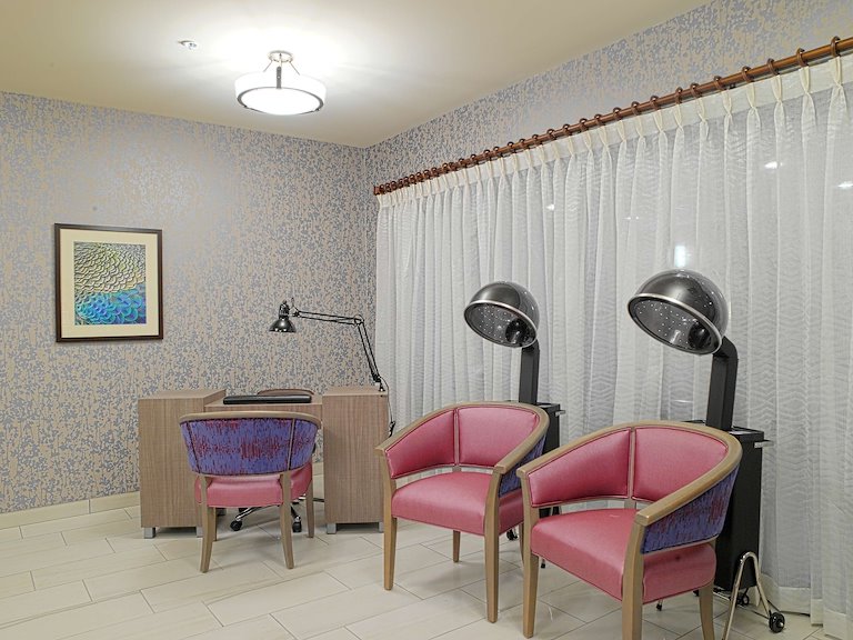 Interior space with salon chairs and desk