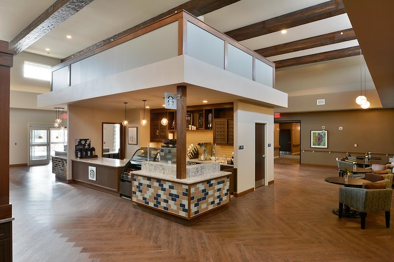 Interior common area with seating and a service counter.