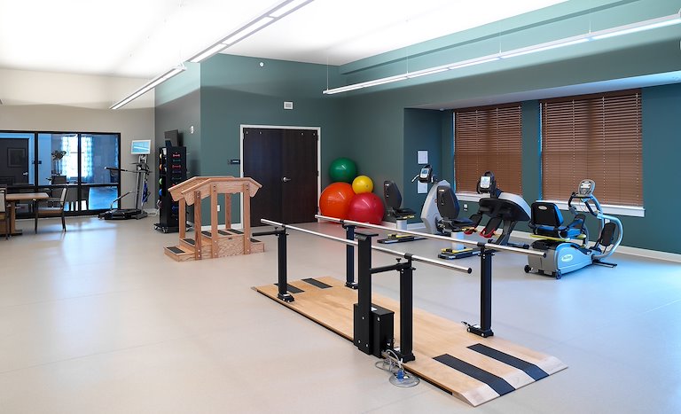 Physical therapy area with exercise equipment