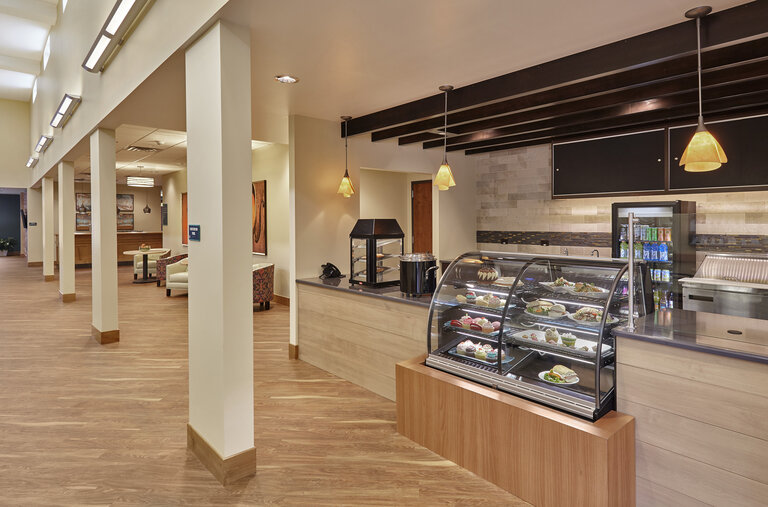 Dine-in area featuring a food display and seating.