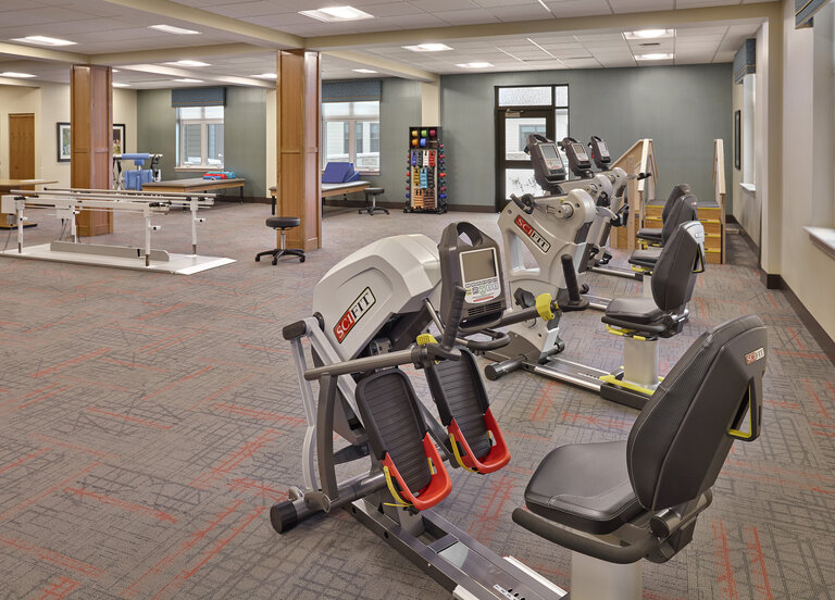 Rehabilitation equipment in a therapeutic exercise room.