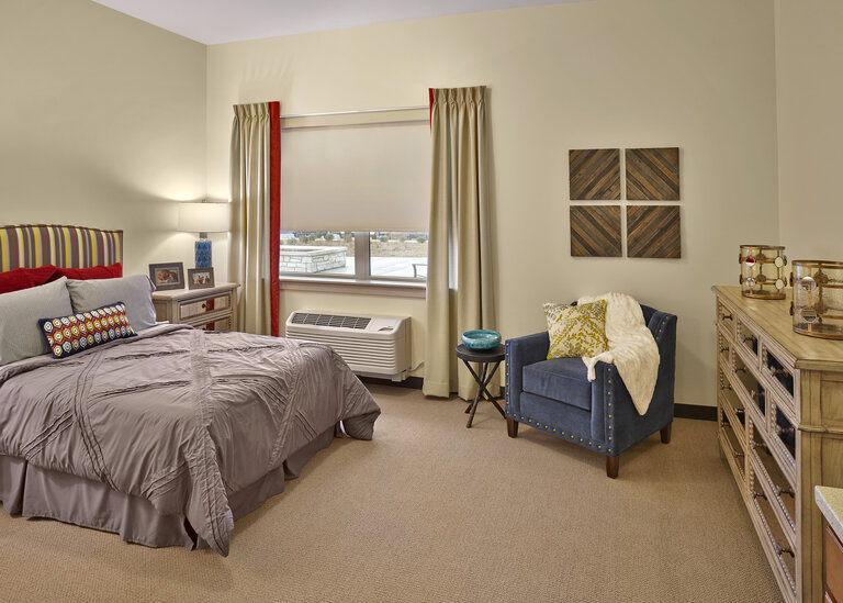 Cozy resident bedroom with decor.