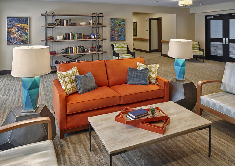 Bright interior common area with colorful furniture.