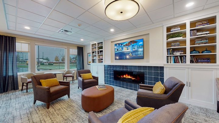 Comfortable lounge area with seating and fireplace.