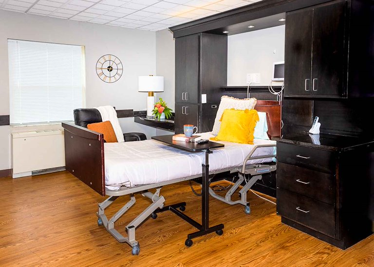 Patient room with bed and amenities
