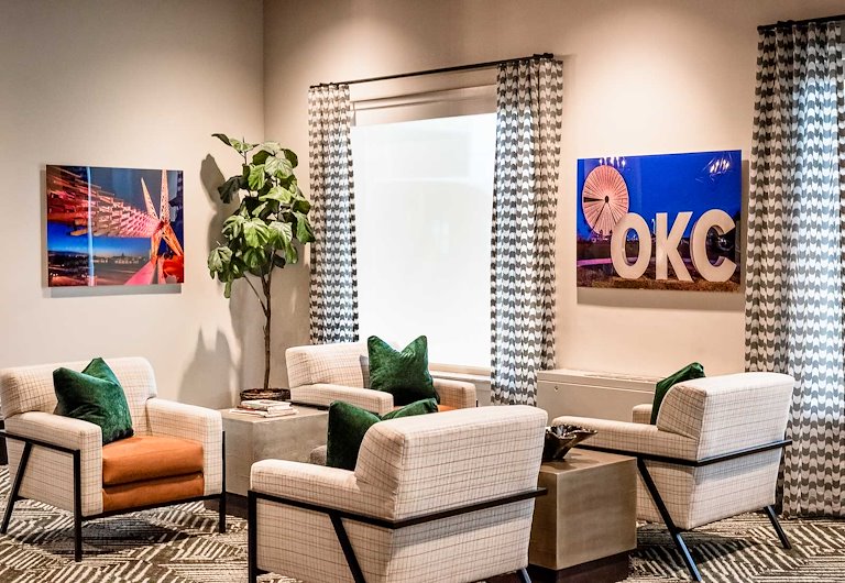 Cozy common area with seating and decorative art.