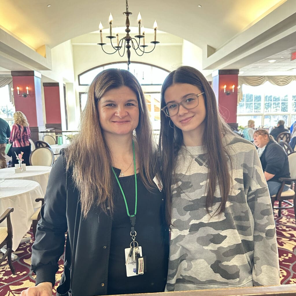 Staff member with a resident in a common area