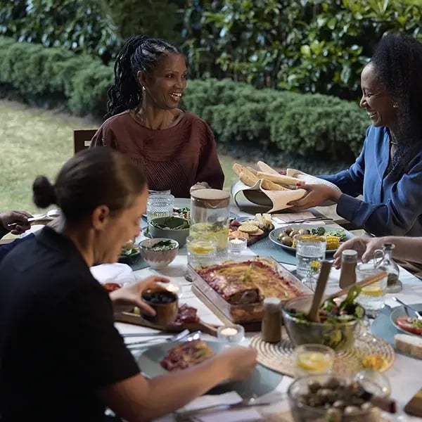 Residents enjoying a meal outdoors together