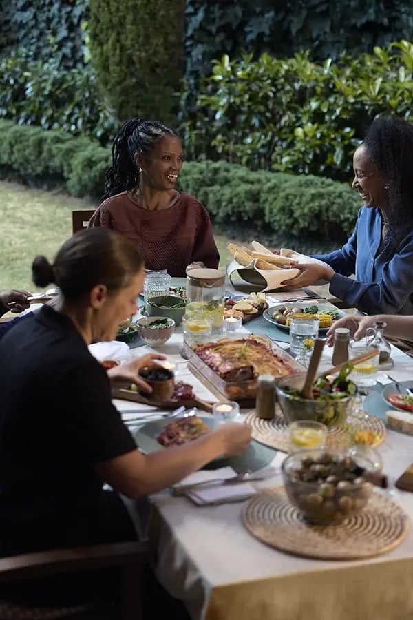 Group of people enjoying a meal outdoors