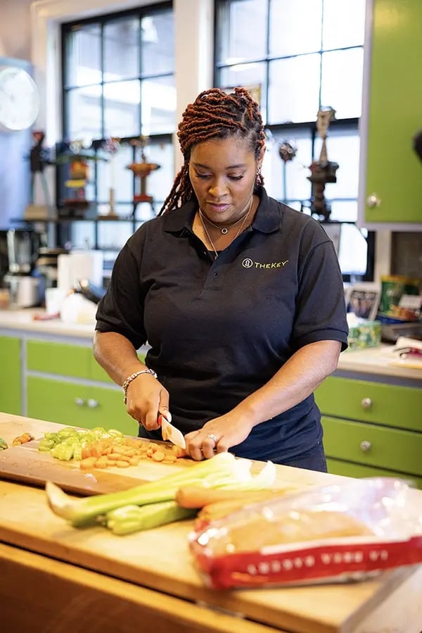 Staff member preparing food in the kitchen