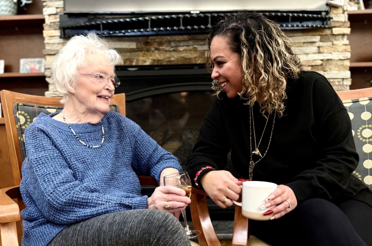 Resident enjoying conversation with staff member