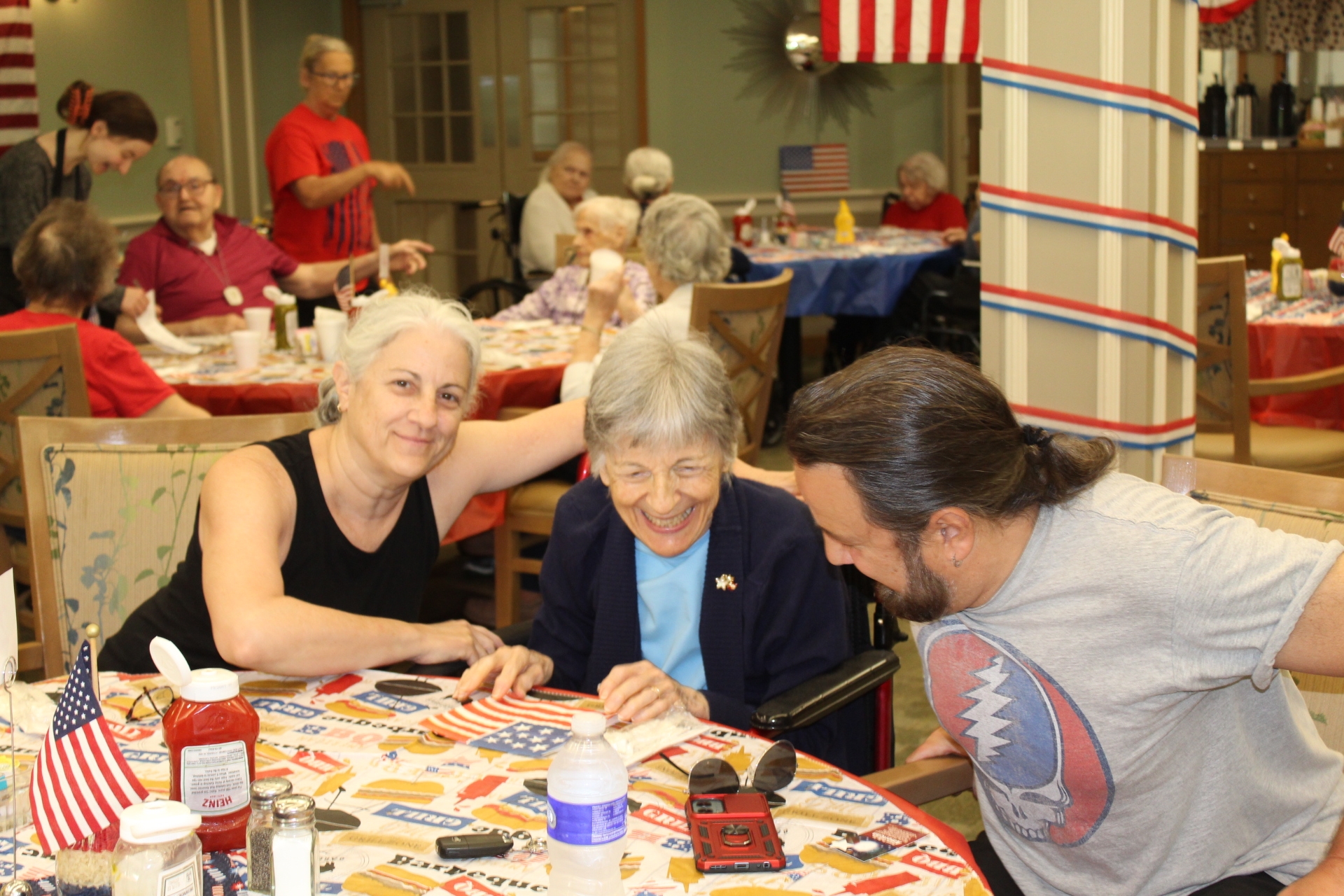 Residents and staff enjoying a festive activity together.