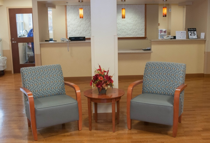 Common area with seating and decorative flowers