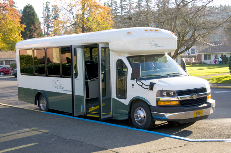 Facility shuttle bus parked outside