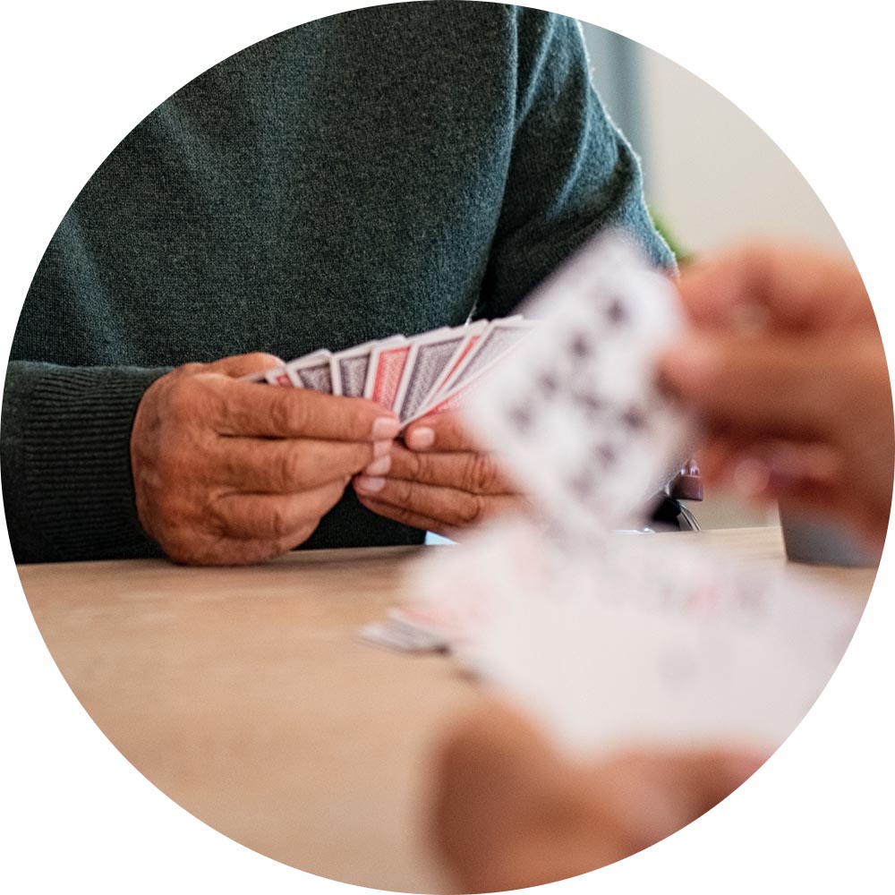 Seniors engaging in a card game.