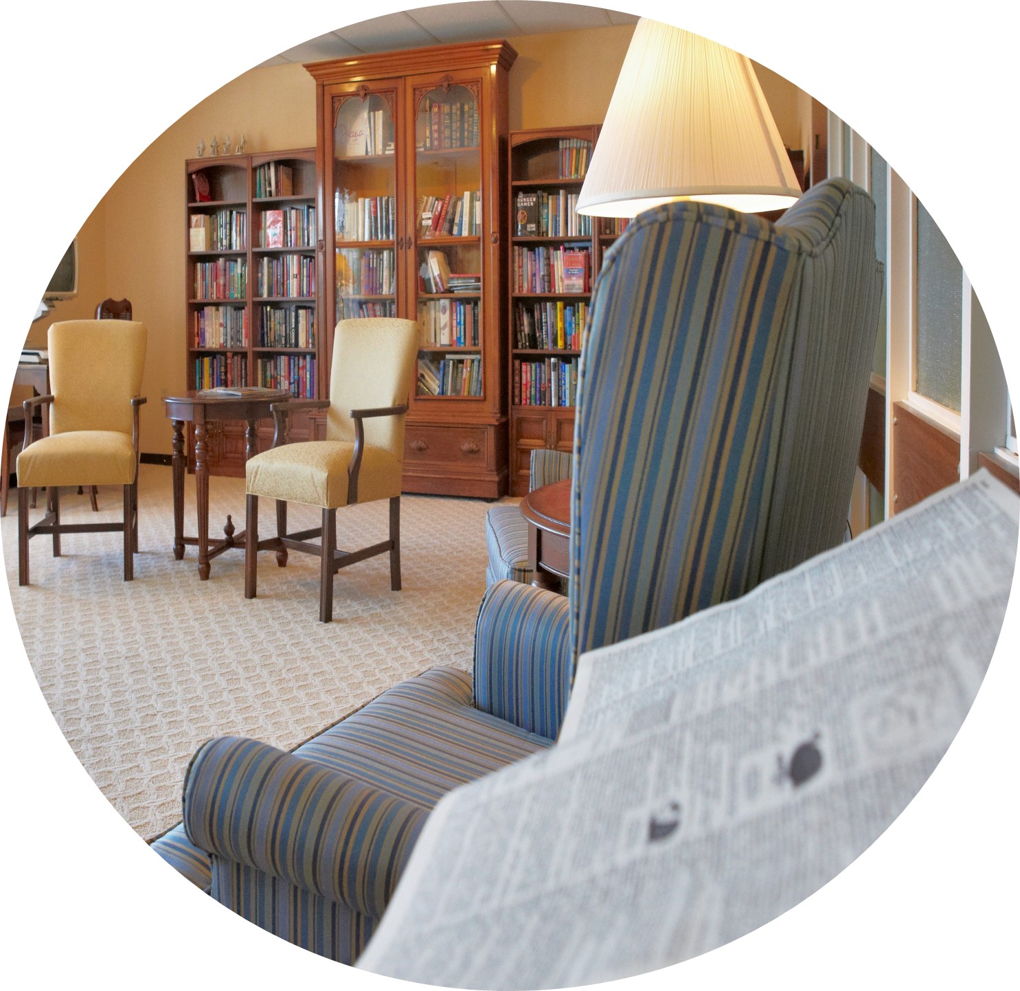 Cozy reading area with bookshelves and seating.