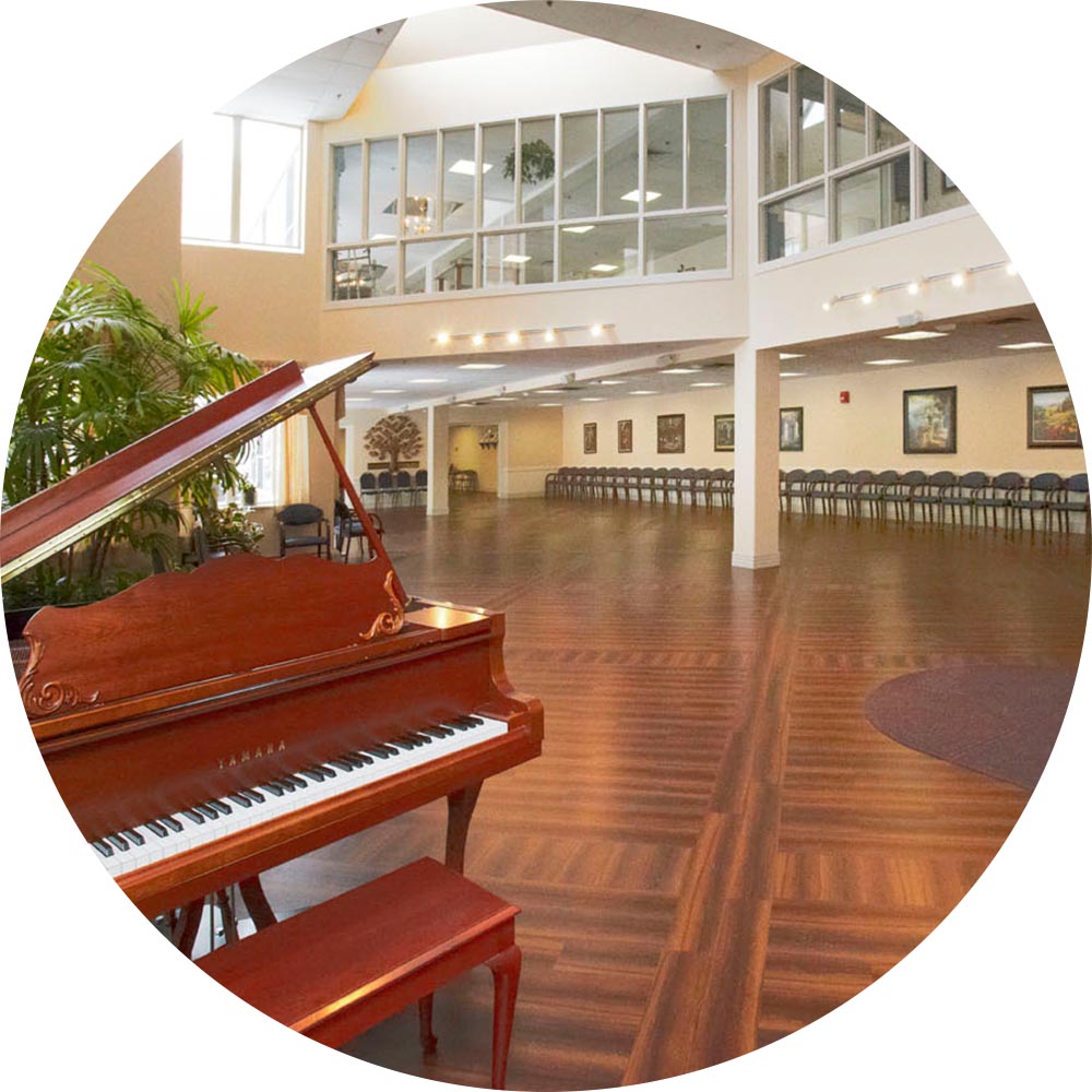 Interior view of common area with piano and seating