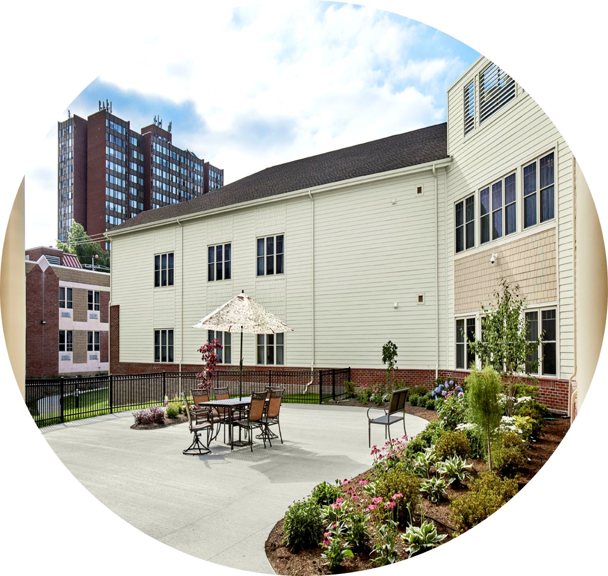 Outdoor area with seating and gardens.